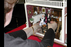 Lyonsworth Hall - Carol B placing her handmade dolls